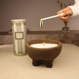 sable de bougie dans pot terre cuite